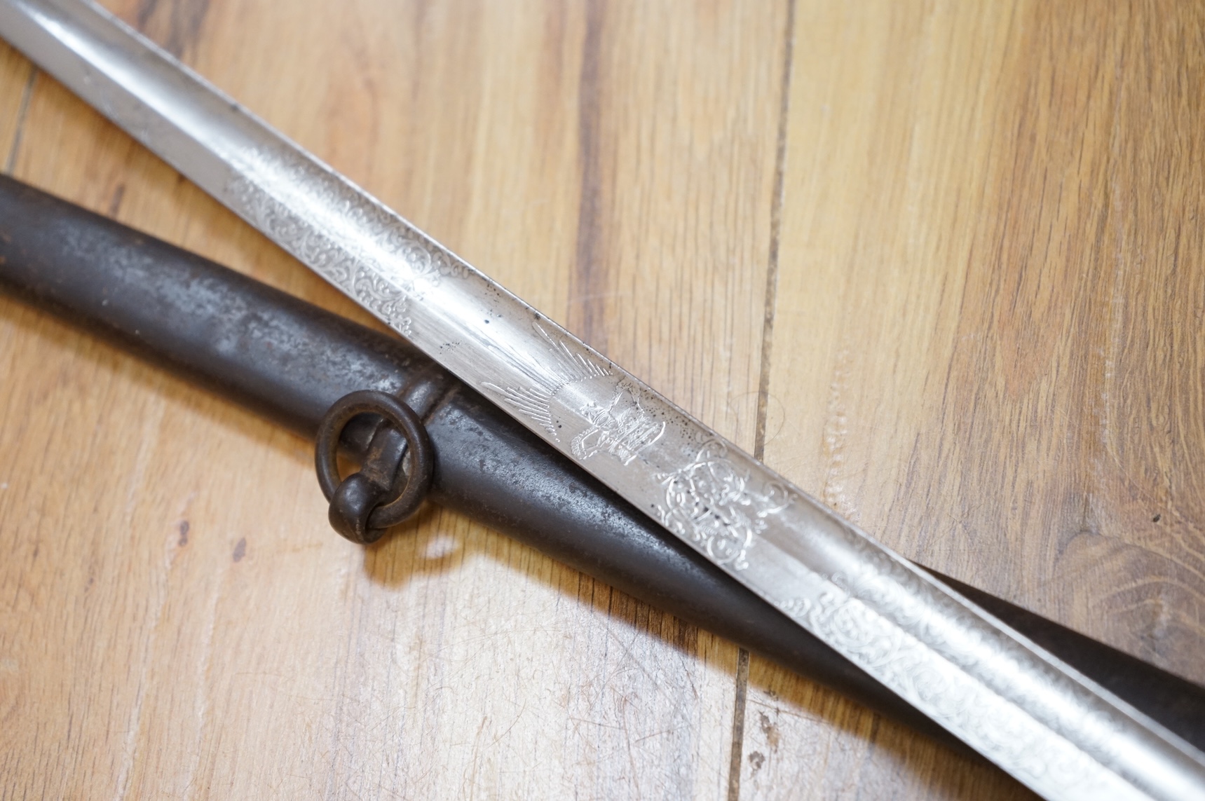 A Victorian 1845 pattern infantry officer’s levee sword, with slender blade etched; Hamburger Rogers & Co., and crowned VR and foliage, regulation pierced brass guard with folding side guard, wire bound fish skin covered